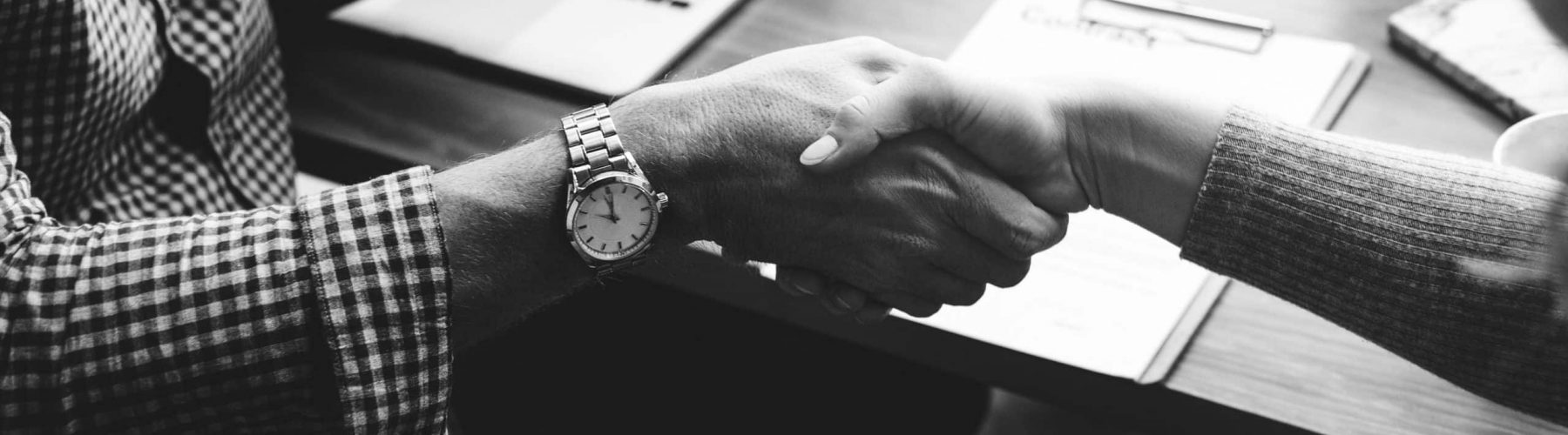 Business people shaking hands in agreement Business people shaking hands in agreement